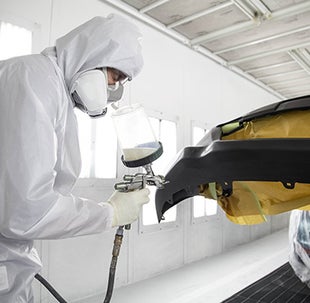 Collision Center Technician Painting a Vehicle | Thornhill Toyota in Chapmanville WV
