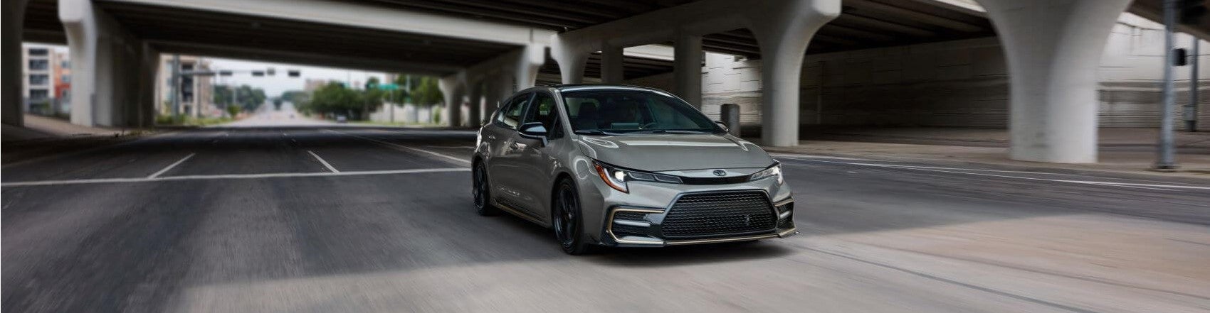 Toyota Corolla Under Bridge Snipped